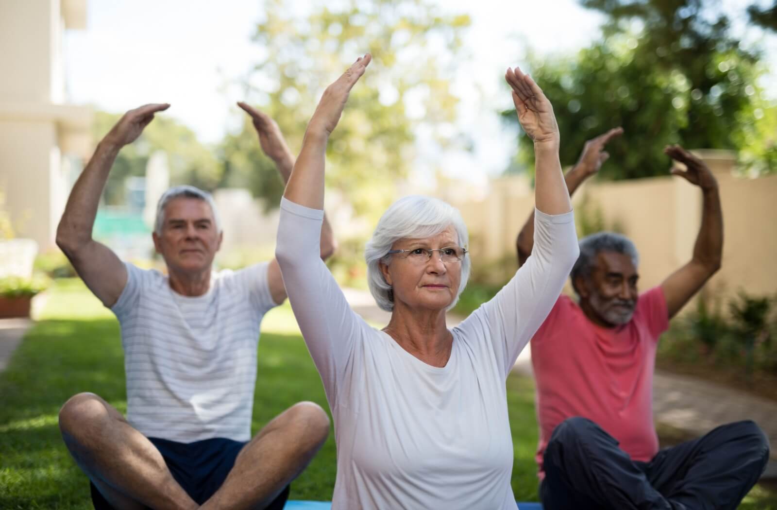Seniors participate in group fitness classes within their community to help maintain good health.
