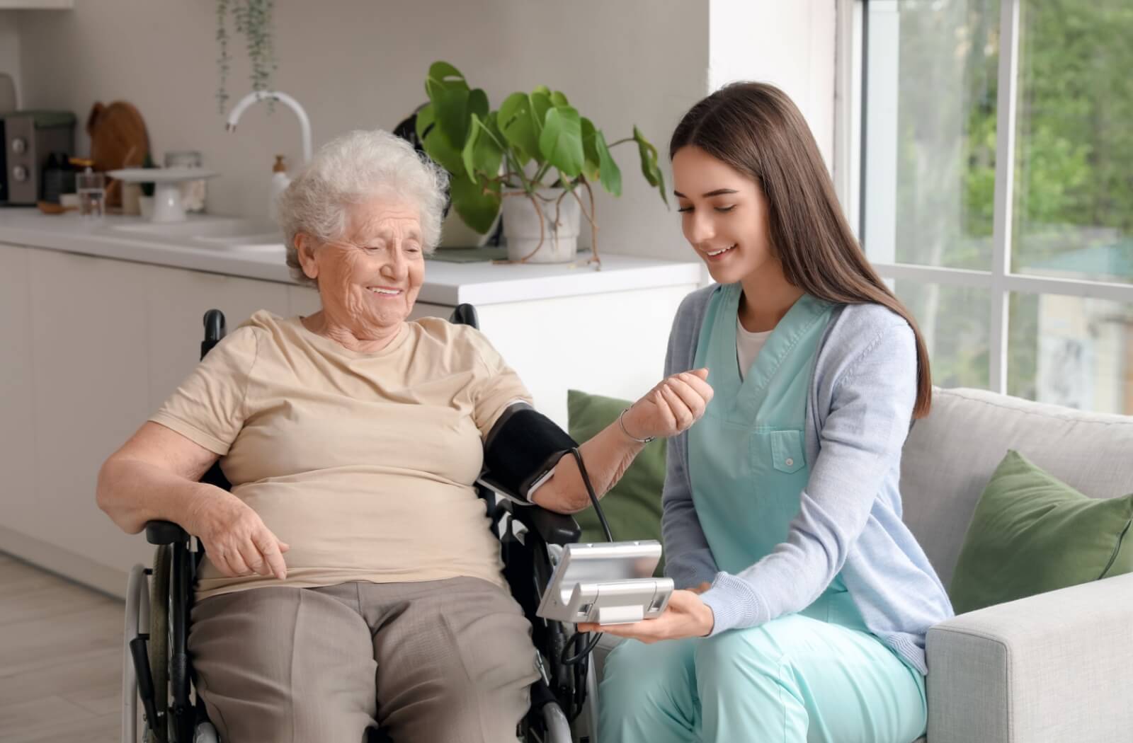 A nurse takes a senior’s blood pressure as part of a medical check-in in memory care