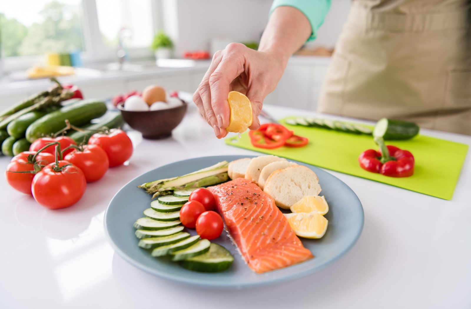 A close-up image of a balanced plate, including vegetables, fatty fish, and grains for a heart-healthy meal.
